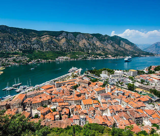 A panoramic view of Kotor, Montenegro, showcasing its historic architecture and stunning coastal landscape.